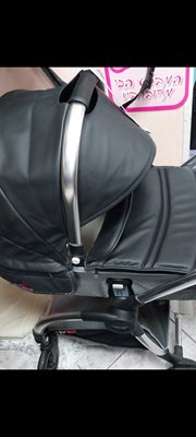 מתצוגה. כחדשה. עגלת בייבי בוסBOSS BOBCAT בעיצוב מדהים בצבע עור שחור ואפור . יח אחת. ריפוד נוסף במתנה